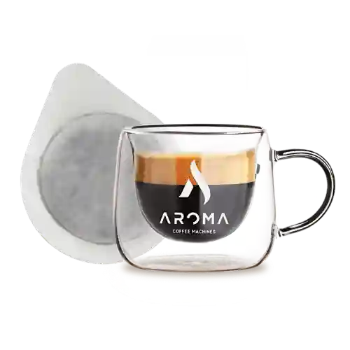 Espresso šoljica sa kafe padom pored nje